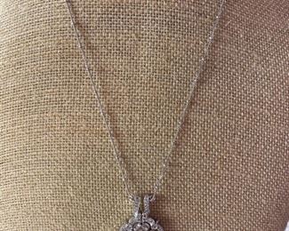 116 - $575 - 14kt white gold with diamonds - chain included. 14kt chain & pendant with movement. 0.380oz or 10.77grams. 1 1/4”t x 3/4”w  - This necklace opens in an another way - i need to photo