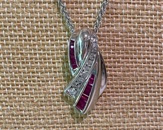 115- $495 - 14kt white gold, rubies, diamonds pendant 1”T x 1/3”w. Chain included. 0.339 oz or 13.60 grams 