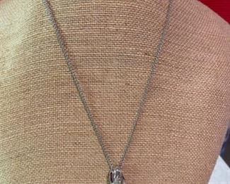 115 - $495 - 14kt white gold, rubies, diamonds pendant 1”T x 1/3”w. Chain included. 0.339 oz or 13.60 grams 