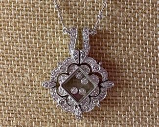 116 - $575 - 14kt white gold with diamonds - chain included. 14kt chain & pendant with movement. 0.380oz or 10.77grams. 1 1/4”t x 3/4”w 