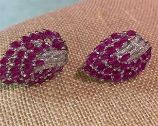 117- $675 - 14kt white gold earrings with rubies. 0.480 oz or 13.60 grams . French backs 