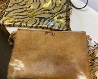 $120 EACH  Large cross over purses made of hide with fringes 