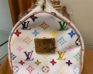 $850 - Louis Vuitton  white coated canvas with multi color monogram 