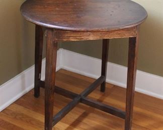 #10. $40.00. Oak side table with cross base 24”h X 24”diameter. Finish issues.