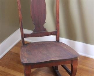 #14. $30.00. Walnut rocker 34”h X 16.5”w X 29.5”d