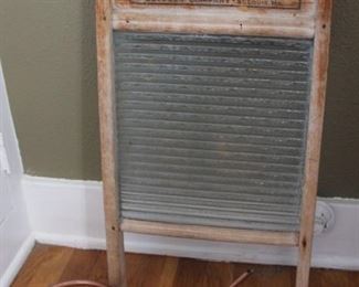 #18.  25.00. Glass front washboard with copper water can 