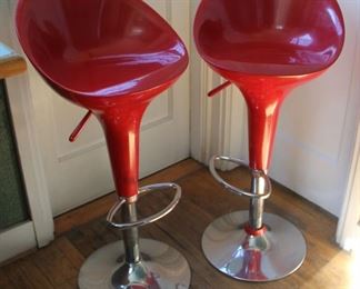 #26.  $150.00 Pair red bar stools some wear to backs 38”h X 17.5