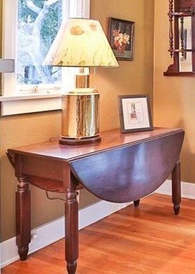 #8. 125.00. Drop leaf table 27.5”h X 49.5”w with leaves up X 42”d with leaves down 19.5
Note: table lamp is not for sale.