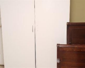 Several of these white storage cabinets in the garage