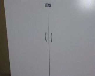 Several nice white composite storage cabinets with locking doors