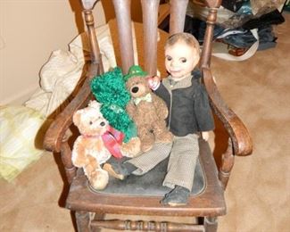 Old wooden rocker w/leather seat $65, Doll, stuffed animals priced separately