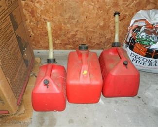 Red plastic gas cans - small 6, large 10