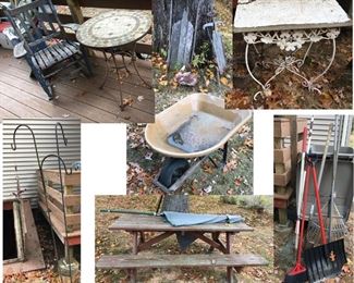 Outdoor furniture including wooden rocker, tile top table, wrought iron table, picnic table, shepard's hooks, wheelbarrow, lawn rakes and shovel.
