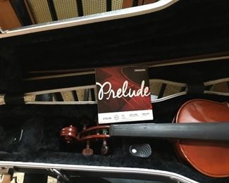 Violin with bow in hard case. 
