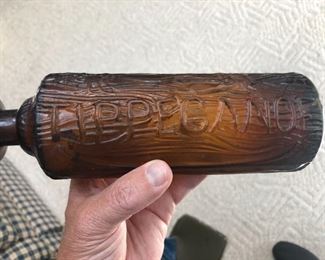Tippecanoe brown bitters bottle, c. 1883.  Brown/amber glass bottle with birch log and canoe relief. One side of the bottle has "TIPPECANOE" while the other side has "H. H. WARNER & Co". The bottom of the bottle says "PAT Nov 20 83 ROCHESTER N.Y.".