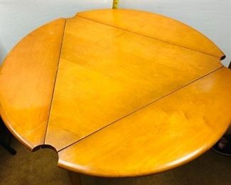 Triangle End Table measures approximately 30 inch triangular table that converts into a round table.