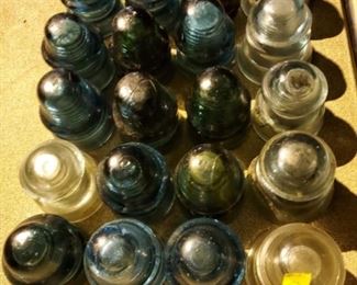 Vintage glass insulator collection in variety of colored glass.