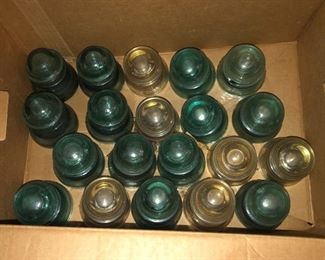 Glass Insulators.  Vintage glass insulator collection including green and clear glass.
