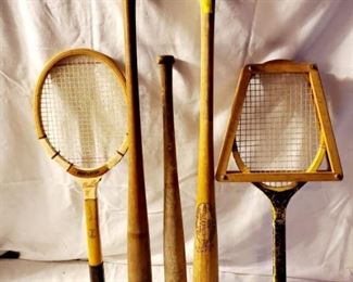 Vintage Tennis Racquet and Hillerich and Bradsby Baseball bats.  