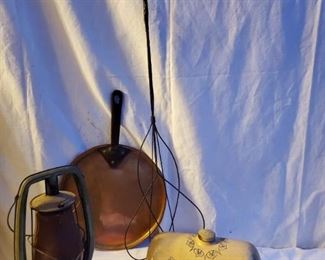 Country Collectibles lot includes rug beater, stoneware foot warmer, railroad lantern and copper skillet.