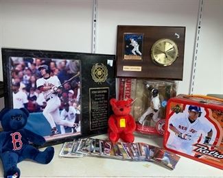 Red Sox Sports Memorabilia .  This features a plaque of Nomar Garciaparra, a vintage retro lunch box, a figurine of David Ortiz and many more Red Sox collectibles.