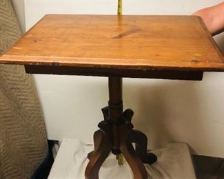Oak wood end table that is approximately 28 inches in height and 22 inches long.