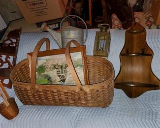 Vintage country collectibles lot includes tin watering can, corner wall shelf, double handled basket, country oil painting, copper ladle, brass oil lamp, etc.
