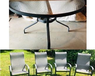 Tropitone glass top table with four matching swivel chairs. Original cost over $2,500 retail new from Litchfield Pools, Litchfield CT. Never has been used!! Great opportunity to own this set!