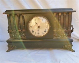 Sessions Mantel Clock.  A classic antique mantel clock with four pillars on each side. Measures approx. 10 inches tall, 5 inches wide and 17 inches long.