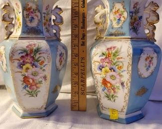S.G.K. China occupied Japan porcelain lamp bases. Pair of porcelain floral lamp bases with white and light blue backgrounds and gold detailing.