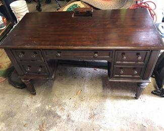 Dark Oak Computer Desk.  Includes electrical outlets on the top of the desk as well as a keyboard drawer and many other storage drawers, made by Hooker Furniture.