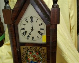 Atkins Clock Co. steeple clock with ornate gold and floral reverse painted glass, original dial.