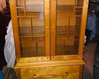 Arts and Crafts style curio cabinet with 2 glass doors, 3 shelves, 1 drawer and 2 bottom doors.