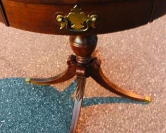 Duncan Phyfe leather top round side table with 1 drawer, carved pedestal and legs, claw feet.