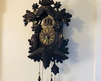 Beautiful wooden cuckoo clock, stag on top, black forest motif, contemporary battery operated clock.