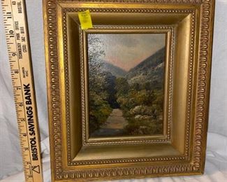 Landscape oil painting on board with ornate gold gilt frame.