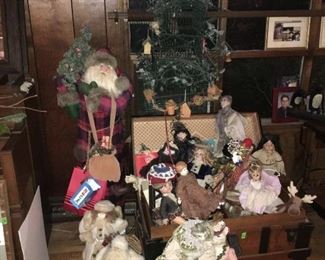 Estate steamer trunk discovery lot includes dolls, large Santa Claus, cat dolls, bird cage, etc.  All being sold as found, including the steamer trunk! (ce) Sat-Lot #84