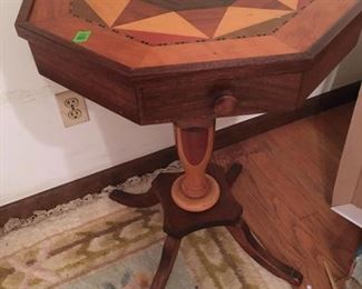 Speciman side table with drawer, pedestal base with 4 legs, beautiful inlay, star pattern top, woods used listed in drawer.  Measures approx. 21.5 inches wide by 29 inches tall. (ce) Sat-Lot #89