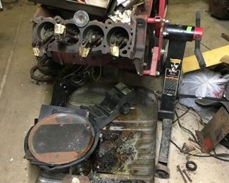 Early engine and engine stand. Local Connecticut area buyers: Would prefer to have picked up in person by buyer or representative.  Pick up date to be scheduled after auction.  This is a life and bulkhead for removal of large items.  Sat-Lot #184