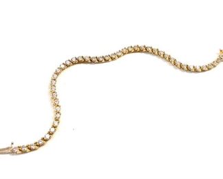 14kt Gold Tennis Bracelet. 44-3mm (approx. 4, 4ct TW) round brilliant cut diamonds. H-1 color S12-S13 clarity. 800 (ce) - Sun Lot #8