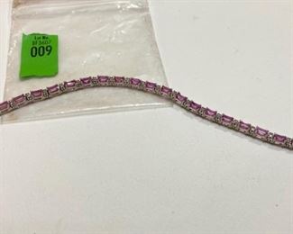 14k White Gold with 5mm x 4mm Rectangle Pink faceted gem (possibly pink sapphire) and diamond Tennis style bracelet. 46 - 1.5mm or 0.01pt round diamonds.  Approx. 0.50ct TW in diamonds.(ce) - Sun Lot #9