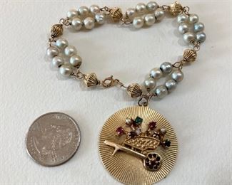 14kt Gold Pearl and Charm Bracelet, multi-genuine gemstones and pearls in large Wheel Barrow charm. 26.5 grams (or approx. 17.04 dwt) (ce) - Sun Lot #21