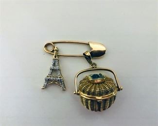 14kt Gold Nantucket Basket Charm, Eiffel Tower Charm and Pin. Nantucket basket opens with inscription on bottom of basket, seascape enamel on top, Eiffel Tower charm with diamonds, pin is 14kt gold.  Weighs 9.0 grams or 5.9 dwts. (ce) - Sun Lot #25