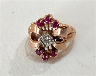 14kt Rose gold ring with six (6) genuine Rubies and one 1 round 3mm (o.10pt) older cut Diamond, 5.3 grams or approx. 3.40 dwt. (ce) - Sun Lot #31