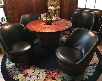 Barrel table and chair set.  Table measures approx. 41.5 inches diameter. 4 matching barrel chairs. Great decorator set! (ce) - Sun Lot #54