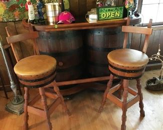 Barrel Bar and Bar Stools.  Bar measures approx. 60 inches wide x 43 inches tall x 19 inches deep.  Storage in back of bar (contents not included).  Great Man Cave decorator set!  (ce) - Sun Lot #55