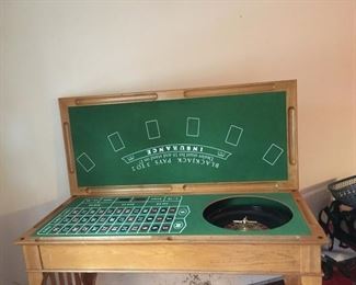 Roulette, Black Jack, and Craps game table.  3 games in 1!  Measures approx. 47 inches wide x 37  inches tall x 21 inches deep. (ce) - Sun Lot #59