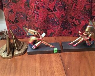 1920'S Gerdago Art Deco Figural Bookends, by sculptor Gerdago. They are cast metal with a gold finish, hand decorated in polychrome. The figures are mounted on thick marble bases. Before Erte, Gerdago was famous for his lavishly costumed ladies.  The bookends are 7.5" tall and 6.5" wide at the base.  Set of Brass sailing ship bookends. (ce) - Sun Lot #80