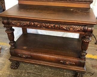 Victorian monumentally carved, R.J. Horner oak server with 2 drawers, huge claw feet, carved columns polls and drawer front. Attributed to RJ Horner, with all original finish. Measures approx. 45 in. wide x 20 in. deep x 40 in. tall. - Sun Lot #90