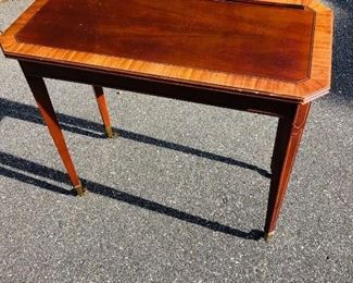 Secret compartment table, top lifts to secret storage area.  Was being used as music box stand for music box Lot 100.  Measures approx. 32 inches long x 16 inches wide x 28.75 inches tall.  inlay on top and legs, nice, all original condition. - Sun Lot #100A